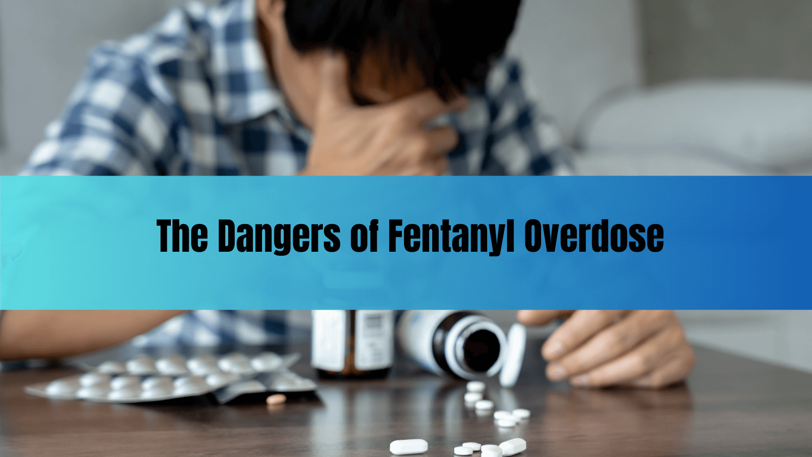 Distressed man with spilled pill bottles and text “The Dangers of Fentanyl Overdose,” emphasizing the urgency of recognizing and preventing fentanyl overdoses in Arizona.