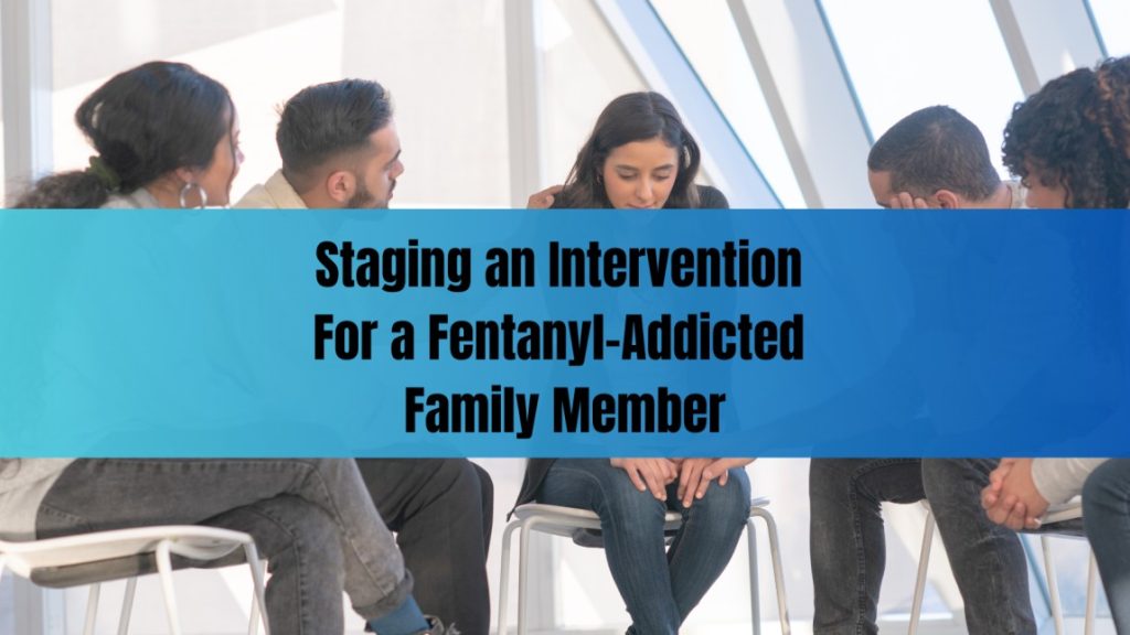 A group of people sit in a circle offering support to a distressed woman, representing an intervention setting for a family member struggling with fentanyl addiction.