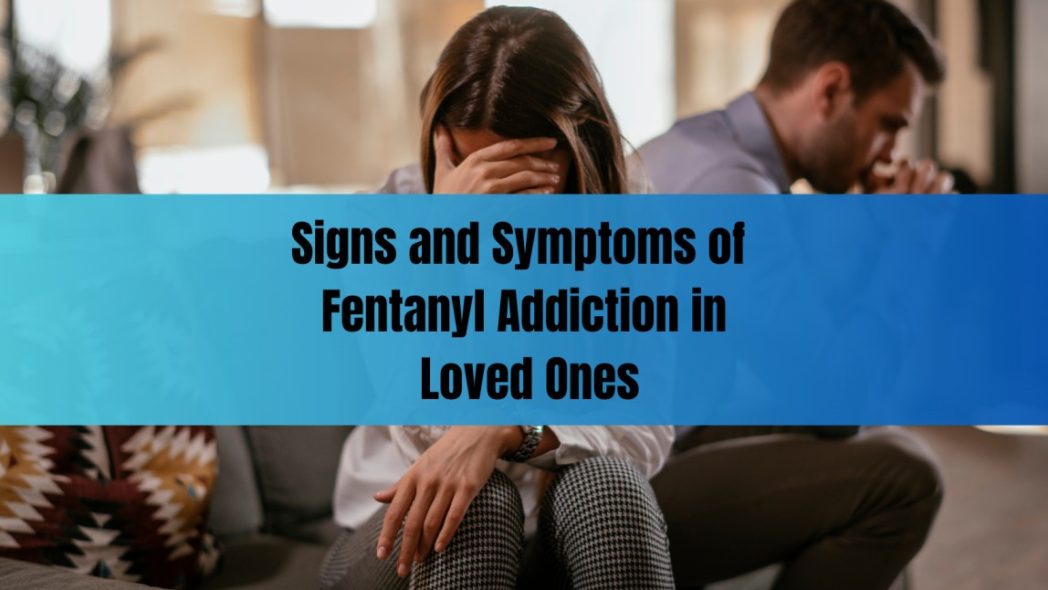 Distressed couple sitting apart on a couch, conveying emotional strain, in the context of recognizing signs and symptoms of fentanyl addiction in loved ones.