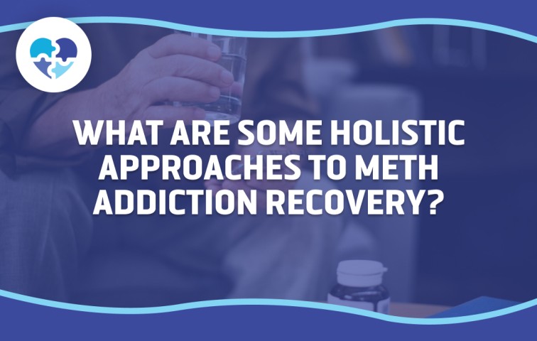 A person holding a glass of water with medication nearby, representing holistic approaches to meth addiction recovery.