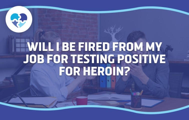 Two coworkers in a serious discussion at a desk with office supplies, reflecting concerns about job risks after testing positive for heroin use in Arizona.