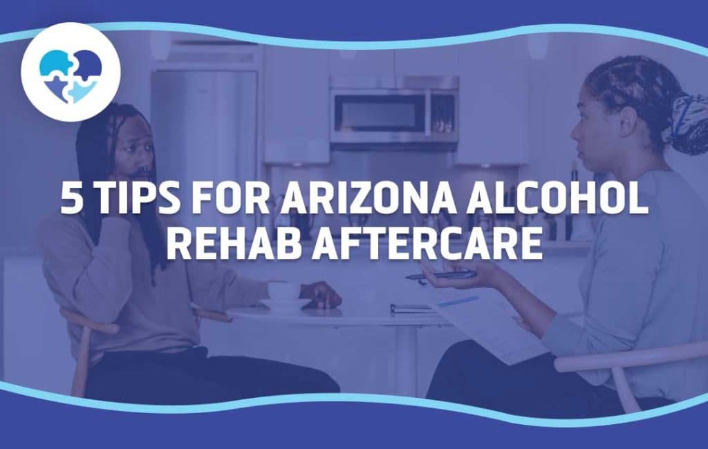 Two individuals having a focused discussion in a modern kitchen, symbolizing effective communication and planning for successful alcohol rehab aftercare in Arizona.