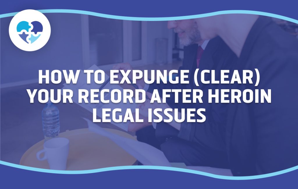 A person discussing legal documents with a professional, focusing on clearing or expunging a record after heroin-related legal issues, emphasizing the steps involved in the process.
